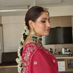 The complete bridal hairstyle. A traditional long braid beautifully woven with fresh gajra flowers, adding a fragrant and classic touch to the overall wedding look.