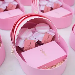 Welcoming a new life is a precious moment. Our custom baby announcement hampers, like these adorable pink cradle boxes, are a whimsical and sweet way to share your happy news.