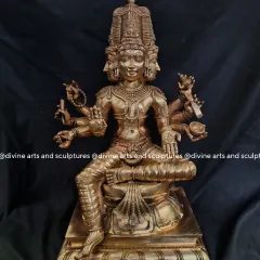 A bronze sculpture of Lord Brahma, the creator god and part of the Hindu Trimurti. His four heads, representing the four Vedas, are sculpted with serene expressions.