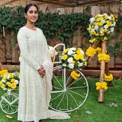 A client looking absolutely ethereal in her white georgette Chikankari gown. This photo captures the grace and elegance of the design perfectly.