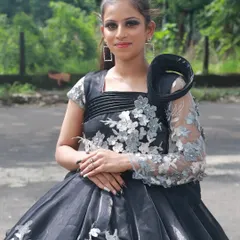 This dramatic black gown is paired with a sophisticated makeup look, all created by a student. I teach them how to balance bold outfits with elegant makeup.