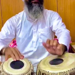 A close-up of my Ustadji playing. You can see the lifetime of dedication and knowledge in his hands. It is a blessing to learn from him.