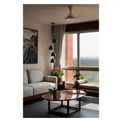 A quiet corner with a view, featuring a cascading pendant light and a comfortable daybed. These are the small, thoughtful spaces I love to create for relaxation.