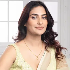This model shot showcases a delicate gold chain with a heart pendant. The close up on the model's neck highlights how the piece sits, giving it a relatable and aspirational feel for everyday luxury.