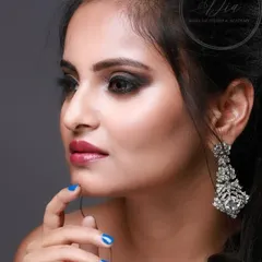 A side profile of the classy cocktail look, highlighting the sharp contouring on the cheekbones and the detailed blending of the eyeshadow. I teach how to create these defined features for a polished finish.