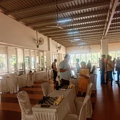 Setting up for an inter-society tournament in a spacious clubhouse. We provide all necessary equipment, including tables, chairs, and professional chess sets with clocks.