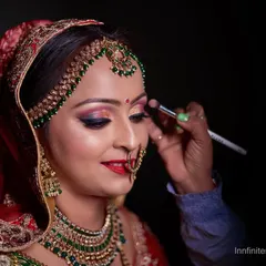 The getting ready process is part of the story. This close-up captures the final touches of the bride's makeup, showcasing the artistry and her calm anticipation.