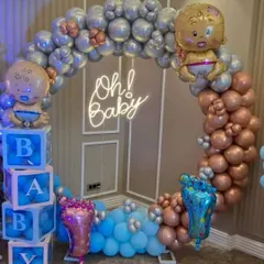 A duplicate image showing the popular 'Oh! Baby' shower decoration. The mix of metallic colors and the neon sign creates a very stylish and celebratory atmosphere for the parents-to-be.