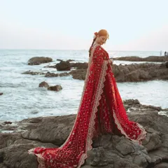 We believe every bride deserves a portrait that feels like a piece of art. Here, we used the dramatic backdrop of the sea and the flowing red lehenga to create a timeless, powerful image of Alifa on her big day.