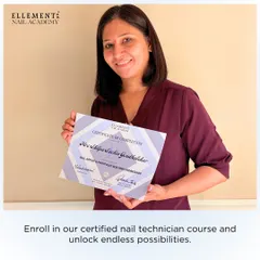 Enroll in our certified nail technician course and unlock endless possibilities. A proud student holds her certificate of completion.