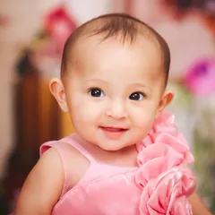 A sweet and simple close-up portrait of a baby girl. I focus on capturing their delicate features and innocent expressions during these sitter sessions.