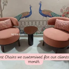 A pair of modern accent chairs we customized for a client, upholstered in a lovely dusty pink fabric. Their curved backs and compact, rounded shape create a chic and inviting seating arrangement, complemented by sequined cushions.