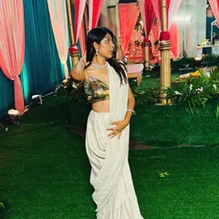 This is one of my favorite looks, a custom-draped saree with a gold sequin blouse that I designed and created from scratch. It's perfect for a cocktail party or a wedding reception. I love helping clients bring their unique vision to life, whether it's for a single event or their entire wedding.