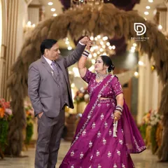 Celebrating 25 years of love, this couple shares a dance during their silver jubilee anniversary party, proving that beautiful moments are worth capturing at every stage of life.