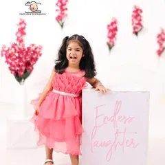 A moment of pure, endless laughter from the birthday girl. Capturing this genuine joy is what makes toddler portrait sessions so special.