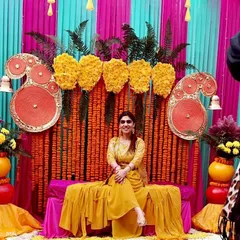 A radiant client enjoying her Haldi ceremony. Seeing her smile against the vibrant, traditional decor I put together makes all the hard work worthwhile.