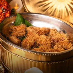A close-up of one of my signature creations, the Kataifi Lamb Kabab. It’s a perfect example of how I love to play with textures and flavours, wrapping succulent lamb in a crispy, delicate nest.