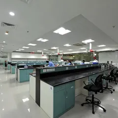 An R&D laboratory space with long benches and specialized equipment. Our design ensures a clean, safe, and efficient environment for scientific work.