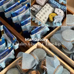 A mandatory quality check before anything goes out. I'm inspecting the treats and the custom celestial-themed cutouts for the 'It's a Boy' announcement hampers.