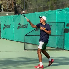Perfecting the backhand swing. This player demonstrates excellent form and follow-through during a weekend coaching session, a result of our focus on disciplined technical training.