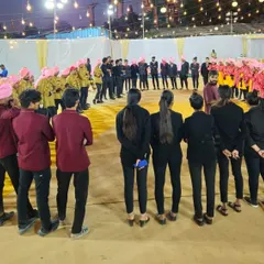 A group photo of our diverse event staff. From servers in traditional attire to managers in professional wear, everyone works together as one team.