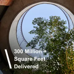 With over 300 million square feet delivered, our legacy is built on a foundation of vision and integrity. This image, looking up through a skylight at Euro School, symbolizes our forward-looking approach, always reaching for light and innovation.