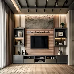 A contemporary TV unit design featuring a mix of materials, including a stone-textured central panel and dark grey cabinetry. The asymmetrical open shelving is perfect for displaying decor, and the entire unit is framed by subtle vertical lighting.