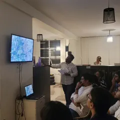 A speaker presenting on a mapping-related topic at our studio. These events help us restart our creative engines and stay connected to the broader academic and design communities.
