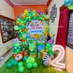 This view of the jungle party setup highlights the light-up number '2' and the artificial grass mat I used to complete the wild animal theme.