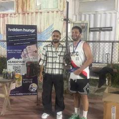 A member of the winning team receiving his prize. We make sure to recognize individual contributions and celebrate every player's effort.