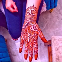 A single-hand design perfect for an animal lover. It features a majestic elephant motif on the wrist, surrounded by intricate floral and paisley patterns.