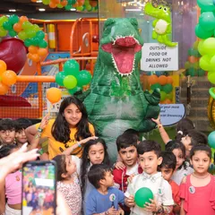 This is what pure party excitement looks like. We hosted a dinosaur-themed birthday bash, complete with a T-Rex mascot that had all the kids roaring with joy. I can bring any theme to life for your child's special day.