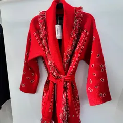 One of my favorite finds from our sourcing trips in Scotland. This red belted cardigan with paisley details and fringe was a piece that perfectly encapsulated the blend of local flavor and bohemian style we were looking for.