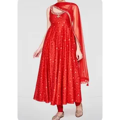 A vibrant red Anarkali suit with a unique cut-out neckline design. This is a great example of how I can incorporate modern tailoring details into a traditional outfit for a distinctive look.