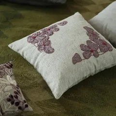 From our 'Ethereal Rose' collection, this cushion conjures images of a romantic serenade. The design pairs the warm, inviting tones of wine with the delicate beauty of embroidered rose motifs on a textured base.