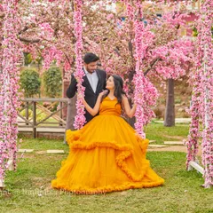 A fairytale moment captured on our flower-adorned swing, set within the beautiful Japanese cherry blossom grove. The vibrant yellow gown adds a perfect pop of color.