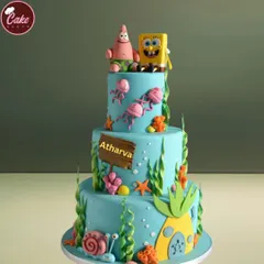 A three-tiered underwater adventure with this SpongeBob SquarePants theme cake. It features detailed, hand-crafted fondant figures of SpongeBob, Patrick, and their friends, making it a huge hit for kids' parties.