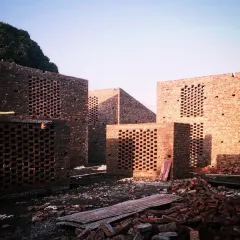 This is the Studio Tarai project in Rudrapur during construction. I find a profound beauty in the rawness of an incomplete building, much like a ruin. The exposed brick screens, standing as pure volumes, hold a sense of possibility and raw emotion before they are defined by their final function.