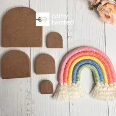 The complete set of five U-shaped rainbow stencils, laid out next to a finished piece. These tools make the crafting process so much easier and more enjoyable.
