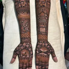 This design showcases a mix of popular traditional motifs. You can see elephants, lotuses, and a space for a mantra or quote, all tied together with classic floral and geometric patterns.