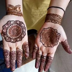 A beautiful and neat mandala design for Karwa Chauth, with two different styles on each hand.