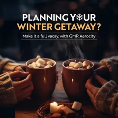 Planning your winter getaway? This image of two people enjoying hot chocolate by candlelight invites you to make it a full vacation with a cozy and festive stay at Aerocity.