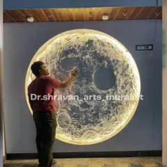 Here I am adding the final touches to a large, enchanting moon mural in Bangalore. The built-in LED lighting makes the textured surface glow, turning the wall into a major feature of the room.