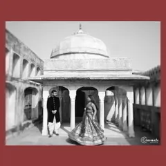 The grandeur of a palace courtyard is given a timeless feel in black and white. The motion of the bride's lehenga contrasts beautifully with the strong architectural lines.