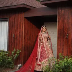 A grand entrance deserves a grand look. The long, flowing veil and stunning lehenga are perfectly matched with our signature bridal makeup, creating a look of pure elegance.