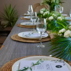 We believe presentation is just as important as taste. Here's an elegant sit-down dinner table we arranged for a private party, complete with custom menus and floral centerpieces.