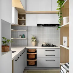 This 'Mellow Menlo' kitchen is soothing and cottagish, with a monochrome palette of soft greys and whites. We extended the space from the foyer to create a compact yet highly functional layout with plenty of storage.