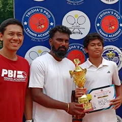 Our head coach with Yashas after his win. This moment reflects the strong guidance and mentorship that is central to our junior development program.