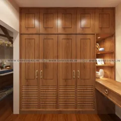 Another view of the teakwood walk-in closet, showing the ample storage provided by the floor-to-ceiling wardrobes and the warm ambiance created by the wooden flooring and focused lighting.