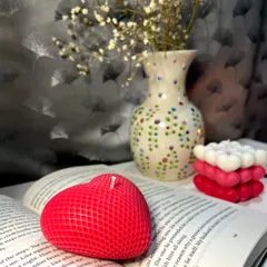 Here you can see the detailed texture of our red heart candle. We designed it to sit perfectly on a stack of books or a bedside table, adding a pop of color and a touch of romance to your personal space.